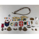 Collection of Militaria cap badges and insignia