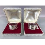 Pair of boxed hallmarked silver napkin rings with engraved leaf design and also engraved "MUM" & "