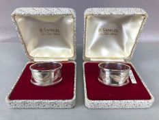 Pair of boxed hallmarked silver napkin rings with engraved leaf design and also engraved "MUM" & "