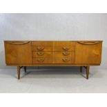 Mid century teak sideboard by Beautility, with four drawers including cutlery drawer and two side