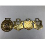 Collection of four vintage Horse brasses to include three RSPCA brasses and a George V, "GOD SAVE