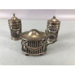 Victorian Silver Hallmarked cruet set with blue glass liners hallmarked for London 1895 and maker