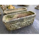 Pair of oblong garden troughs / planters with lions head detailing, each approx 71cm x 28cm x 26cm