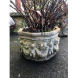 Octagonal garden planter with cherub detailing, approx 29cm in height