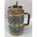 Royal Doulton Lidded jug number 1876 embossed with geometric rosettes and applied foliate mounts