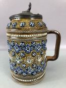 Royal Doulton Lidded jug number 1876 embossed with geometric rosettes and applied foliate mounts