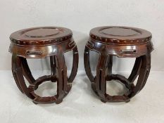 Early 20th Century pair of Chinese hard-wood carved stools, of drum form, supported by five