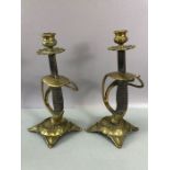 Pair of candlesticks fashioned from cavalry sword handles, decorated brass cast bases and