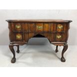 Queen Anne knee-hole writing desk on ball and claw feet, with five drawers and brass handles, approx