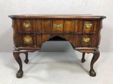 Queen Anne knee-hole writing desk on ball and claw feet, with five drawers and brass handles, approx