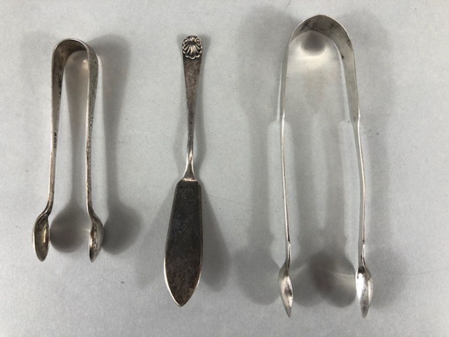 Silver flatware to include Silver hallmarked sugar nips one Georgian *2 and a silver fish fork - Image 17 of 32