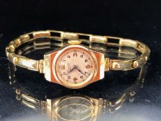 9ct Gold watch case and strap, wristwatch by "Everite" winds and runs (without movement 7.8g)