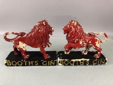 Pair of Booths Gin Red rampant lion advertising ceramic figurines each approx 15cm tall
