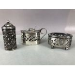 Silver three piece cruet set to include salt pepper mustard with clear glass liners and hallmarked