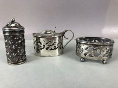 Silver three piece cruet set to include salt pepper mustard with clear glass liners and hallmarked