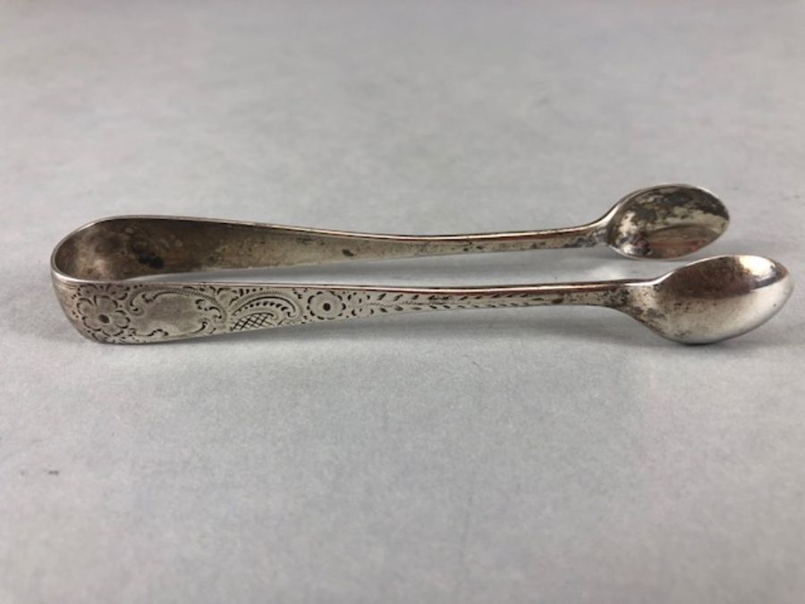 Silver flatware to include Silver hallmarked sugar nips one Georgian *2 and a silver fish fork - Image 20 of 32