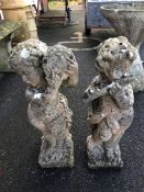 Pair of decorative garden cherubs, each approx 60cm in height