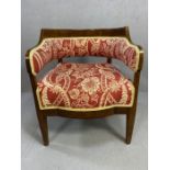 Victorian wooden framed upholstered tub chair on tapering legs with open curved back and red