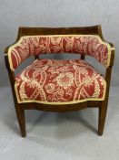 Victorian wooden framed upholstered tub chair on tapering legs with open curved back and red