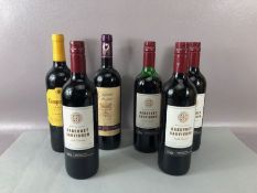 Six bottles of various red wine