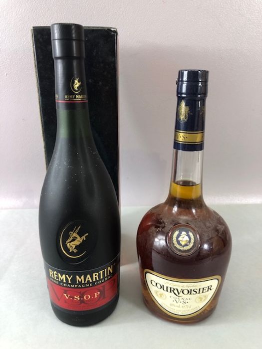 Two Bottles Cognac, one COURVOISIER the other REMY MARTIN VSOP