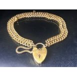 9ct Gold double strand curb link bracelet, links marked 9ct and 375 and a 9ct Gold heart shaped lock