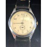 Vintage automatic wristwatch with champagne dial in steel case with subsidiary second hand