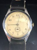 Vintage automatic wristwatch with champagne dial in steel case with subsidiary second hand