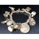 Silver charm Bracelet with approx 12 charms