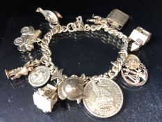 Silver charm Bracelet with approx 12 charms