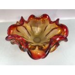 Murano style glass splash vase in shades of red and yellow, approx 28cm in diameter