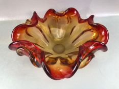 Murano style glass splash vase in shades of red and yellow, approx 28cm in diameter
