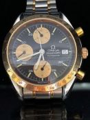 OMEGA SPEEDMASTER AUTOMATIC: OMEGA wristwatch, baton numerals, triple gold subsidiary dials and date