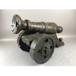 Large wooden ornamental cannon on wheels approx 50cm in length