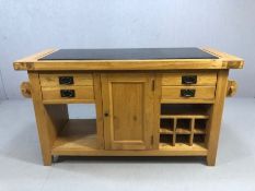 Island kitchen unit consisting of wine rack drawers, cupboards, towel rail with large central