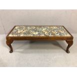 Wooden footstool on queen ann legs with floral cushion, approx 80cm wide