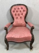 Carved oak framed nursing or bedroom chair in upholstered pink button back fabric on original