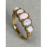 9ct Gold ring set with five graduated Opals in ornate settings size 'N'