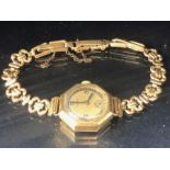 Wristwatch in 9ct Gold Octagonal case by VERTEX on a rolled gold strap total weight approx 15.6g