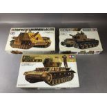 Three TAMIYA unassembled 1:35 scale model tanks: Sturmpanzer, Flakpanzer Wirbelwind, Centaur