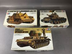 Three TAMIYA unassembled 1:35 scale model tanks: Sturmpanzer, Flakpanzer Wirbelwind, Centaur