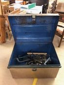Tin trunk containing a selection of vintage tools