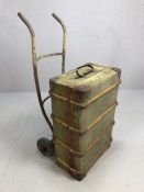 Vintage wooden-bound canvas travel trunk on an original vintage trolley