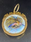 15ct Gold mount containing a silver 2 New Guinea Mark coin dated 1894 and decorated with enamel