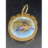 15ct Gold mount containing a silver 2 New Guinea Mark coin dated 1894 and decorated with enamel