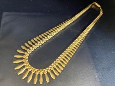 9ct Gold necklace with graduating Gold pendants hung from a curb link chain, marked 375 and ITALY