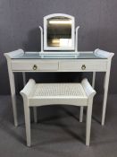 Modern white painted dressing table with glass and rattan top, two drawers and matching stool