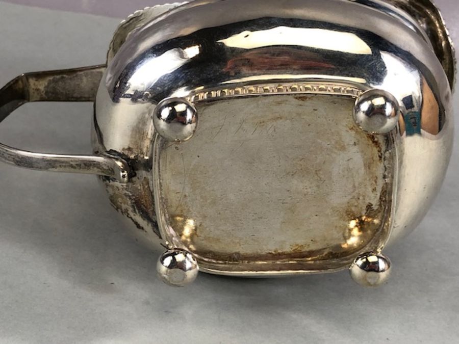 Silver Hallmarked Georgian milk jug on four bun feet with gold gilt interior hallmarked for Exeter - Image 9 of 10