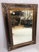 Large ebonised and bronze gilt mirror, approx 102cm x 76cm