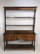 Antique Georgian dresser with five drawers, three planked shelf under, on turned legs, with set of